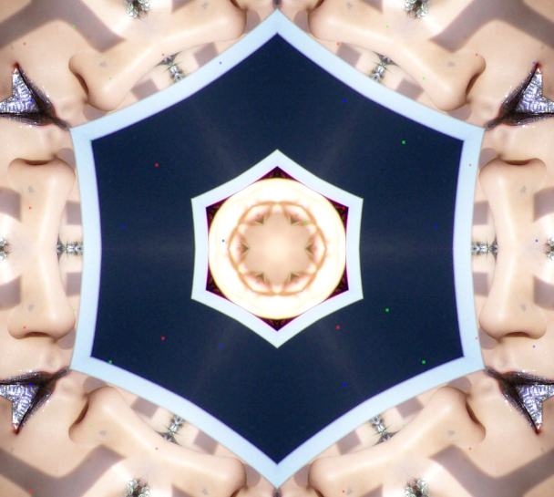 a clique of daughtercells they look like each other

they look like they like each other

black eyes behind thick silver lashes

metallic shimmering lips kissing